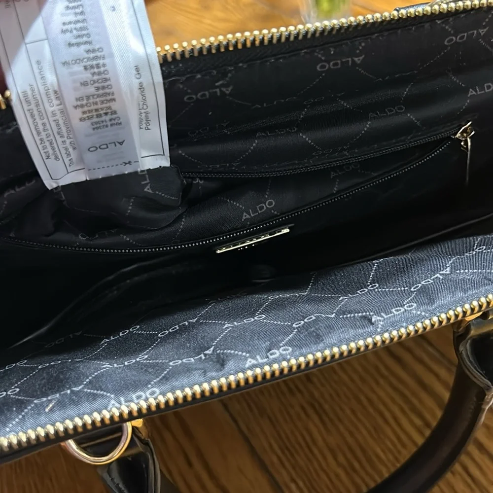 Aldo Faux leather handbag. Shoulder strap missing. Good condition. Black.